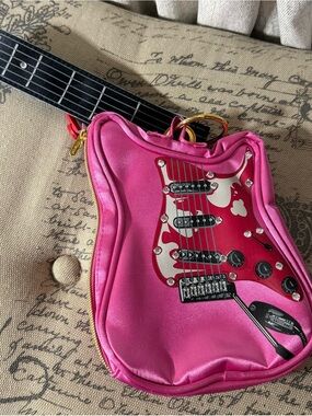 Parcel for Steve Madden pink guitar wristlet